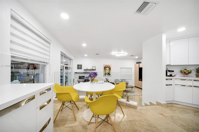 dining area with recessed lighting and visible vents