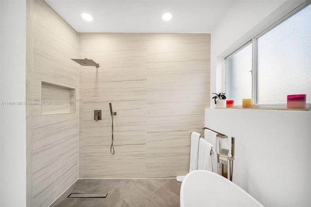 full bathroom featuring tiled shower and recessed lighting