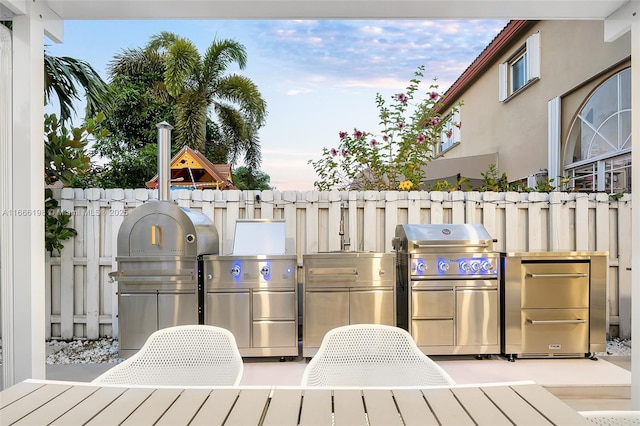 view of patio featuring a grill and exterior kitchen