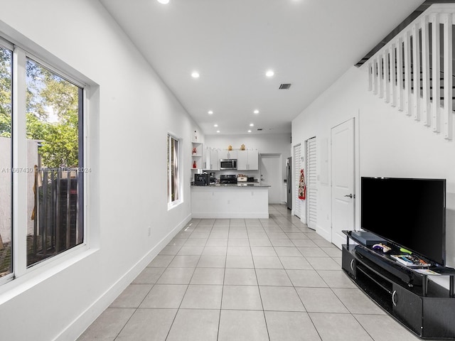 living room with light tile patterned flooring