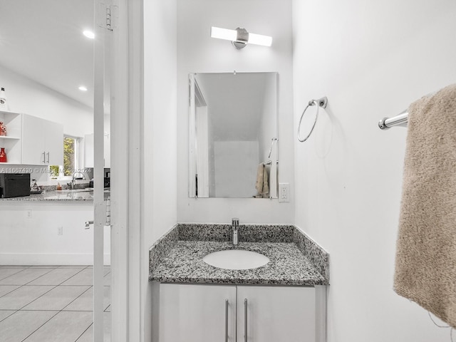 bathroom with tile patterned floors and vanity