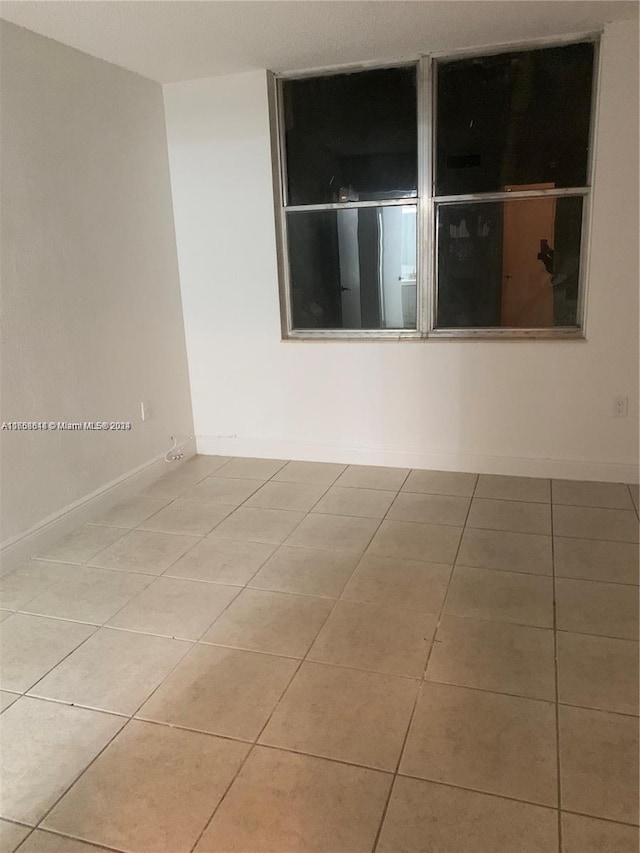 view of tiled spare room