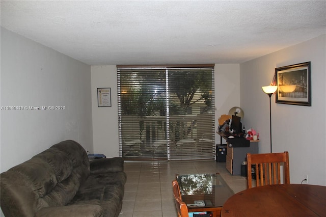 tiled living room with a textured ceiling