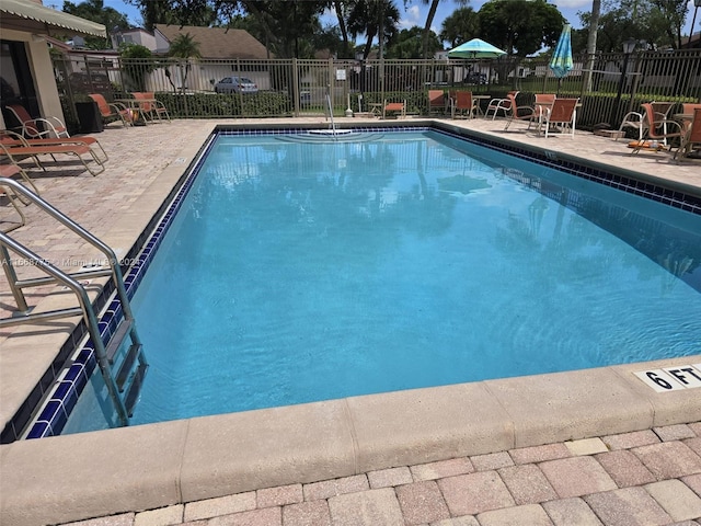 view of swimming pool with a patio