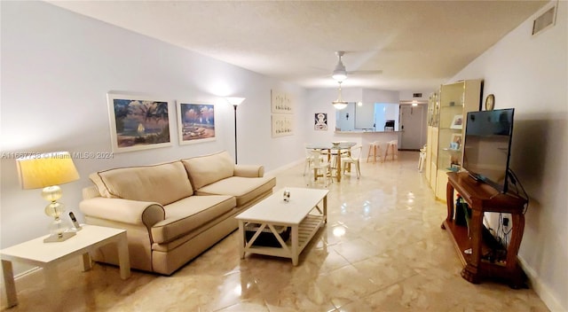 living room with ceiling fan