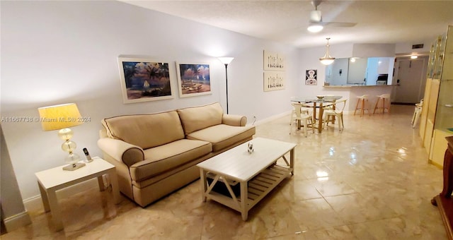 living room featuring ceiling fan