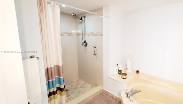 bathroom featuring plus walk in shower