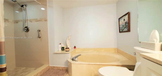 full bathroom with vanity, separate shower and tub, and toilet