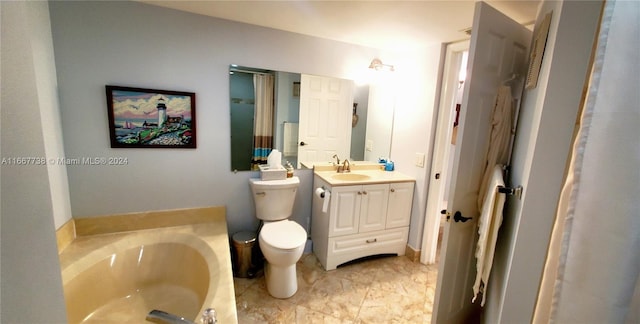 bathroom with a tub to relax in, vanity, and toilet