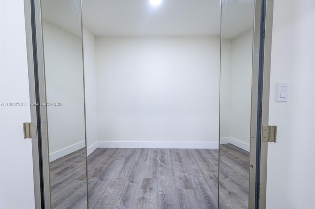 spare room with light wood-type flooring