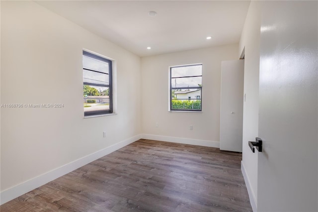 spare room featuring dark hardwood / wood-style flooring