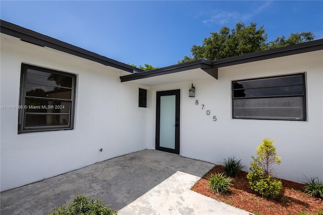 doorway to property with a patio