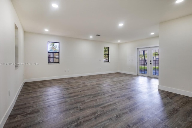 unfurnished room with french doors and dark hardwood / wood-style flooring