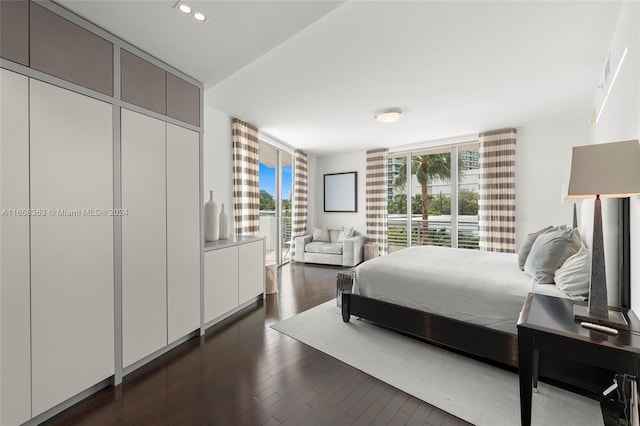 bedroom featuring dark hardwood / wood-style flooring