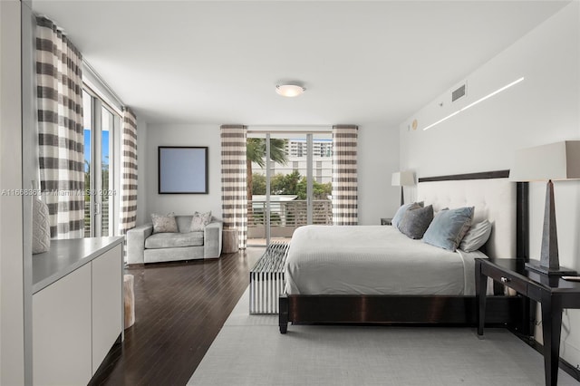 bedroom with hardwood / wood-style floors