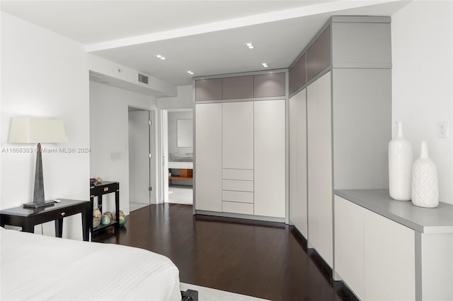 bedroom featuring a closet and dark hardwood / wood-style floors