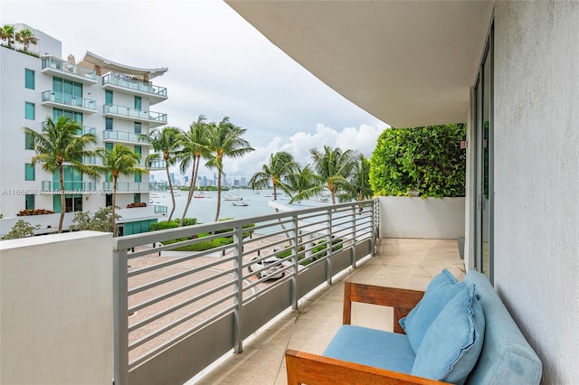 balcony featuring a water view