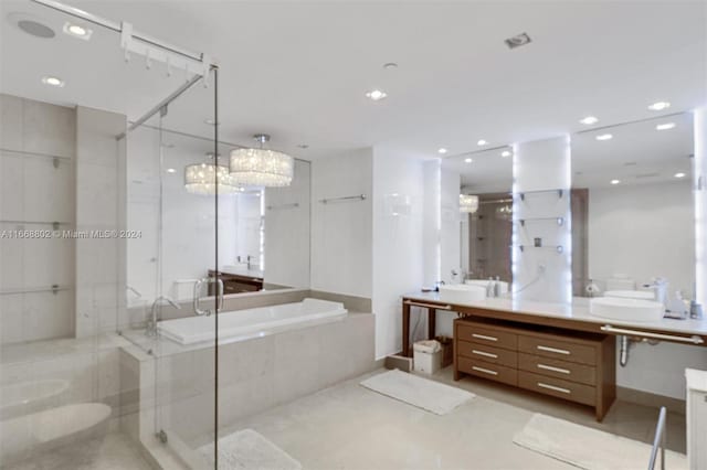 bathroom featuring shower with separate bathtub and vanity