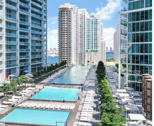 view of pool featuring a water view