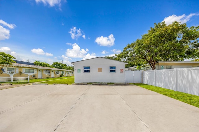 view of side of home with a yard