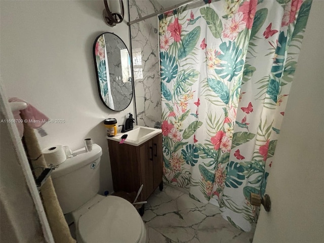 full bathroom with toilet, marble finish floor, curtained shower, and vanity