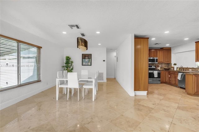 dining space with sink