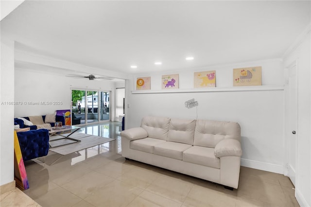 tiled living room featuring ceiling fan and ornamental molding