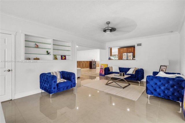 interior space with ceiling fan, built in features, and crown molding