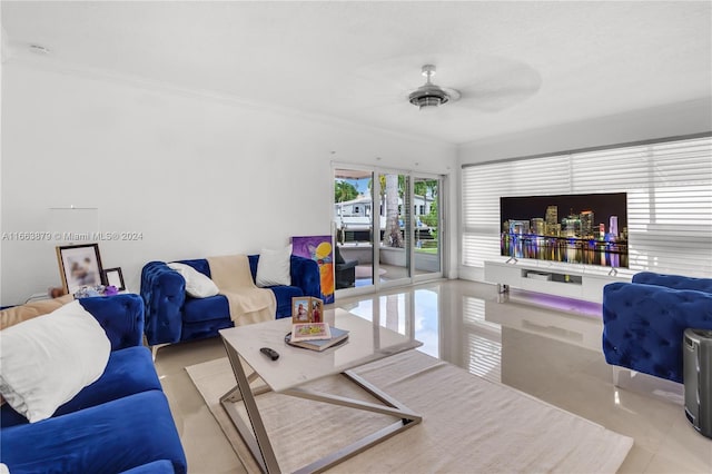 living room featuring ceiling fan and crown molding