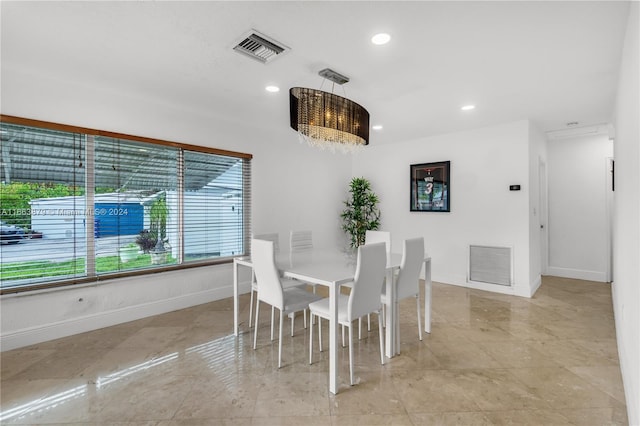 dining area with a chandelier