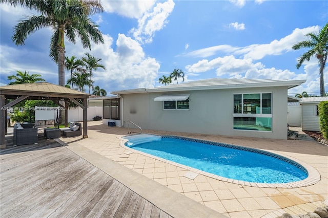 view of pool featuring a gazebo and a patio area