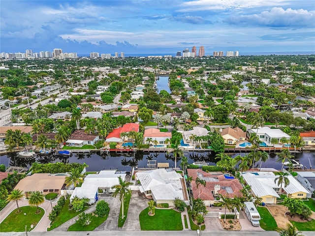 birds eye view of property with a water view