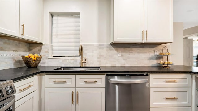 kitchen with sink, range, backsplash, white cabinets, and stainless steel dishwasher