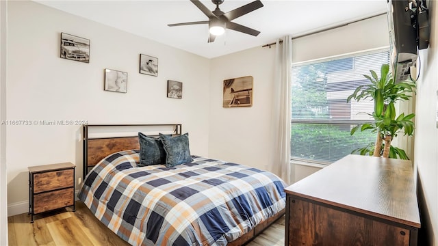 bedroom featuring ceiling fan and light wood-type flooring