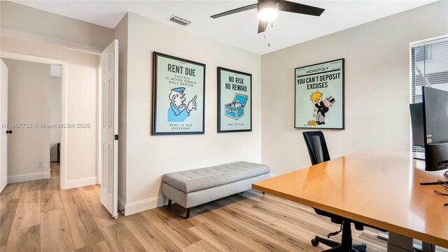 office space featuring ceiling fan and light hardwood / wood-style floors