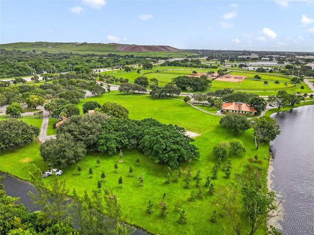 drone / aerial view featuring a water and mountain view