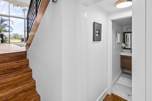 stairway featuring hardwood / wood-style floors