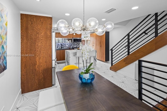 dining space featuring an inviting chandelier