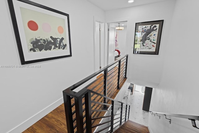 stairway featuring hardwood / wood-style flooring