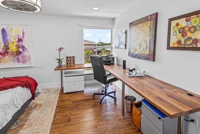 office with dark hardwood / wood-style flooring