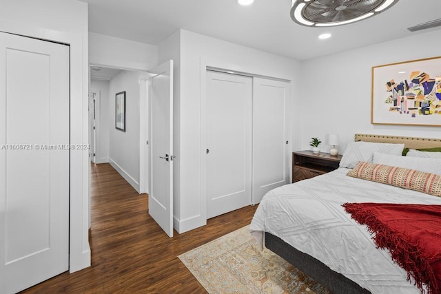 bedroom featuring dark hardwood / wood-style flooring and a closet