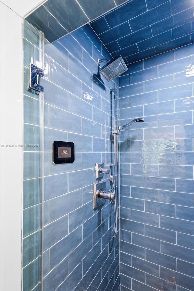 bathroom with a tile shower