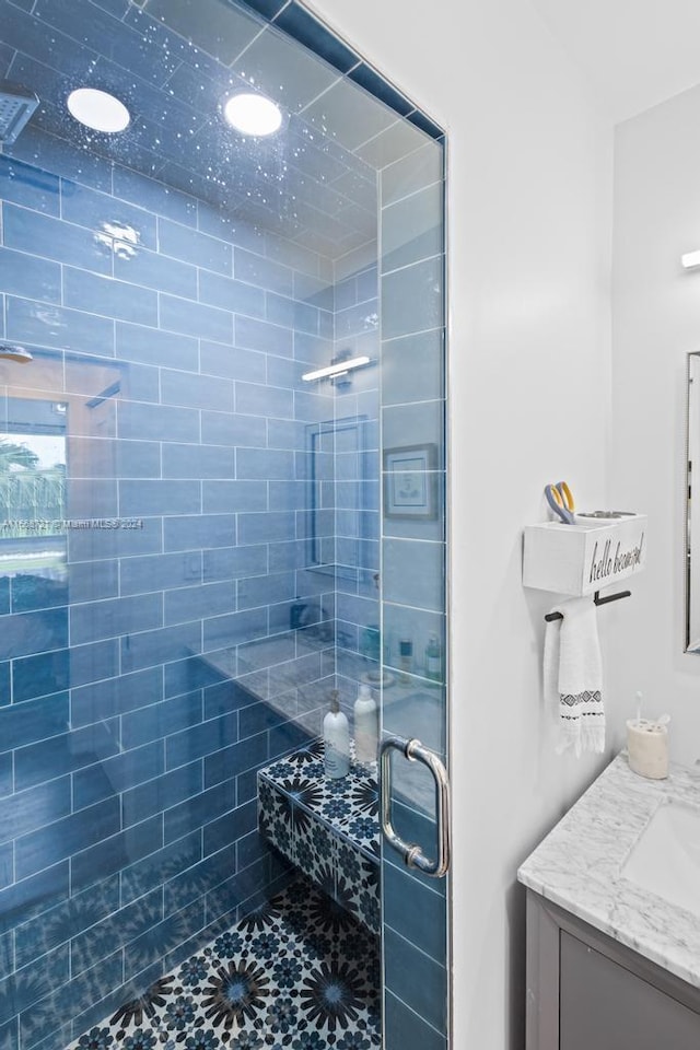 bathroom with vanity and an enclosed shower