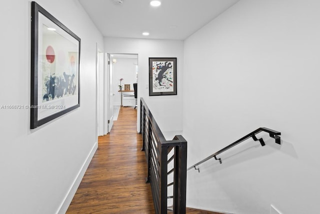 hallway with dark hardwood / wood-style flooring