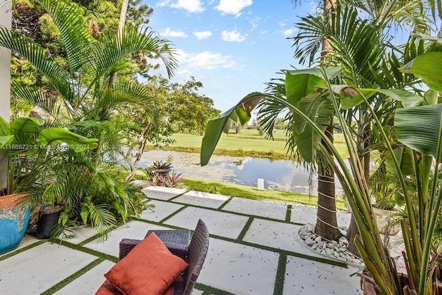 view of patio with a water view