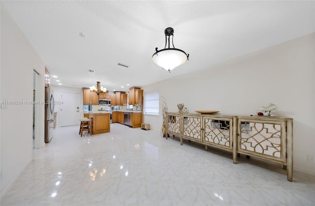 interior space featuring a textured ceiling and an inviting chandelier