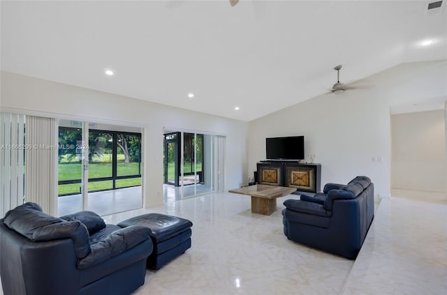 living room featuring ceiling fan and lofted ceiling