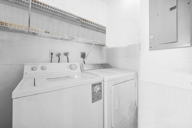 washroom featuring separate washer and dryer and electric panel