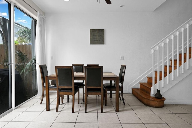 dining space featuring ceiling fan and light tile patterned floors