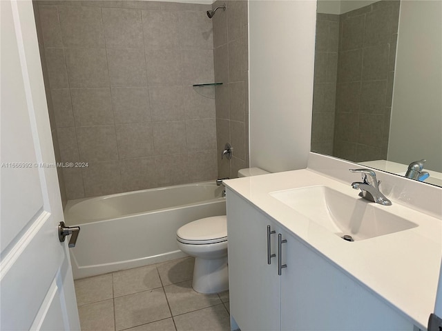 full bathroom featuring vanity, tiled shower / bath combo, toilet, and tile patterned floors